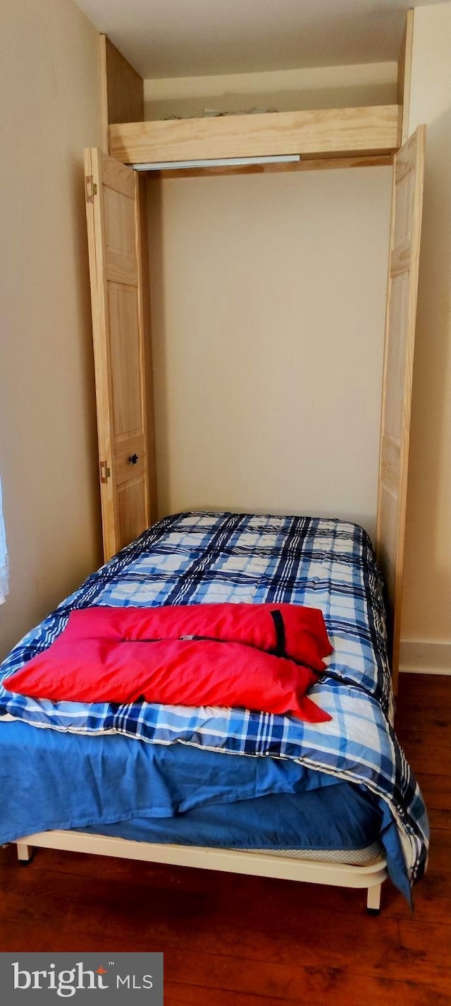 24171 Adelaide St, Parksley, VA 23421 - bedroom featuring baseboards and wood finished floors