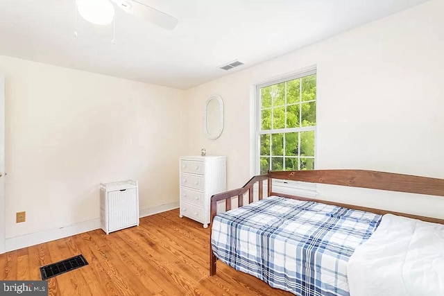 24171 Adelaide St, Parksley, VA 23421 - bedroom featuring light wood-type flooring, baseboards, ceiling fan, and visible vents