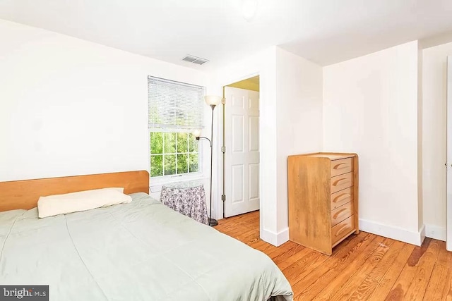 24171 Adelaide St, Parksley, VA 23421 - bedroom featuring light wood finished floors, baseboards, and visible vents
