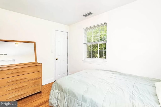 24171 Adelaide St, Parksley, VA 23421 - bedroom with light wood finished floors and visible vents