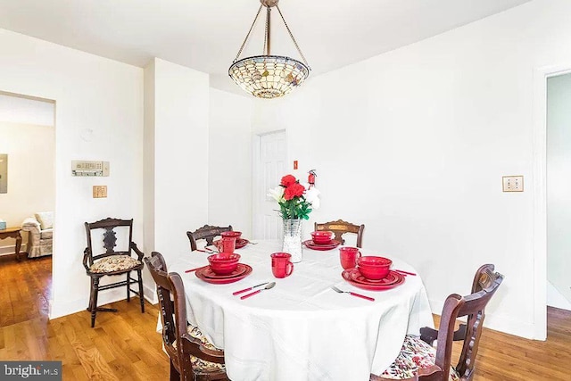24171 Adelaide St, Parksley, VA 23421 - dining area with baseboards and wood finished floors