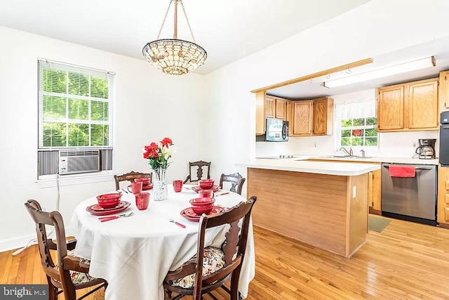 24171 Adelaide St, Parksley, VA 23421 - dining area featuring cooling unit, light wood-style flooring, and a notable chandelier