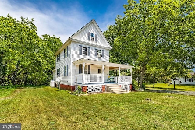 24171 Adelaide St, Parksley, VA 23421 - view of front facade featuring a front lawn and a porch