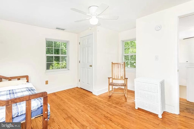 24171 Adelaide St, Parksley, VA 23421 - living area featuring baseboards, light wood-style floors, ceiling fan, and visible vents