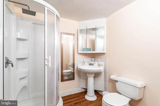 24171 Adelaide St, Parksley, VA 23421 - full bath featuring baseboards, wood finished floors, toilet, and a shower stall