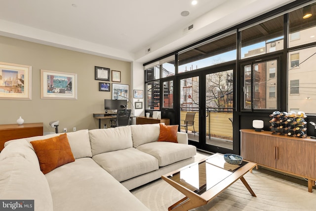 living area with visible vents and recessed lighting