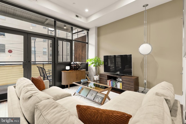 living room with baseboards, french doors, recessed lighting, and visible vents