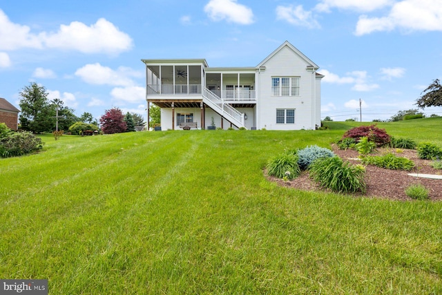 15920 Broadfording Rd, Hagerstown, MD 21740 - back of property with a sunroom, a lawn, ceiling fan, and stairs