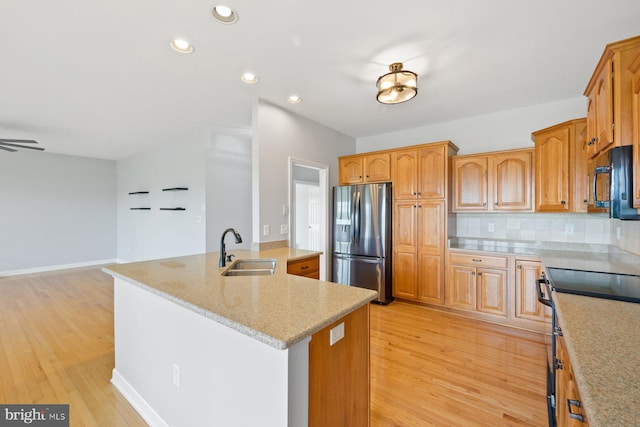 15920 Broadfording Rd, Hagerstown, MD 21740 - kitchen with stainless steel appliances, a sink, recessed lighting, light wood-type flooring, and a center island with sink