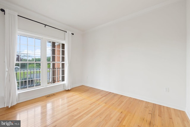 15920 Broadfording Rd, Hagerstown, MD 21740 - empty room with wood finished floors, baseboards, and ornamental molding