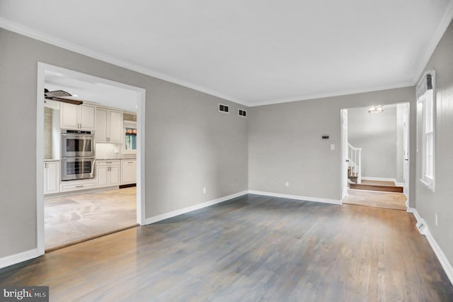 3228 Canterbury Ln, Fallston, MD 21047 - unfurnished room featuring stairs, crown molding, wood finished floors, healthy amount of natural light, and baseboards
