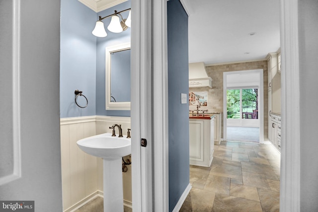 3228 Canterbury Ln, Fallston, MD 21047 - bathroom featuring stone finish floors, crown molding, a sink, and a wainscoted wall