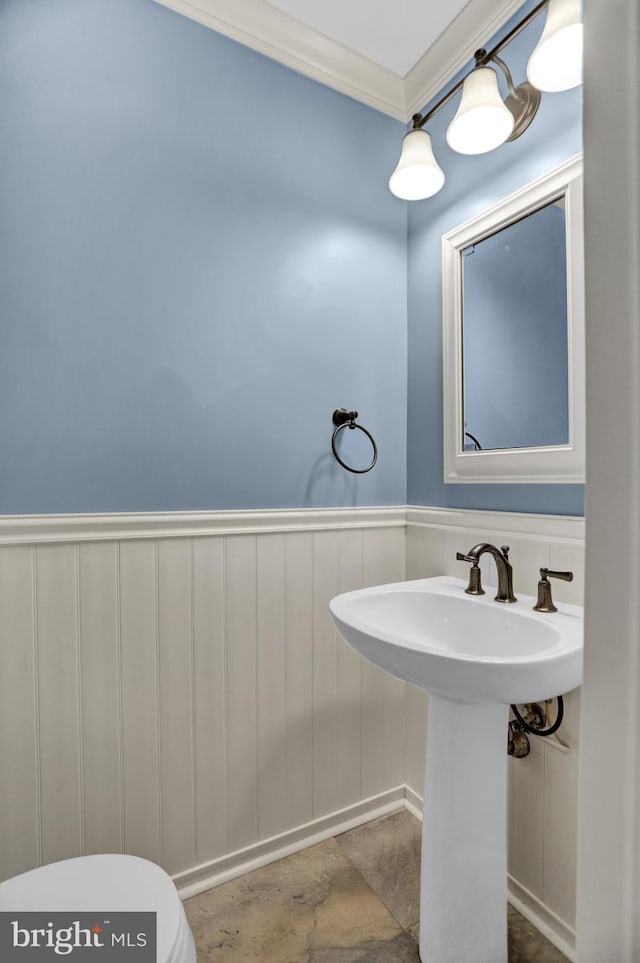 3228 Canterbury Ln, Fallston, MD 21047 - half bath with toilet, a wainscoted wall, ornamental molding, a sink, and a decorative wall