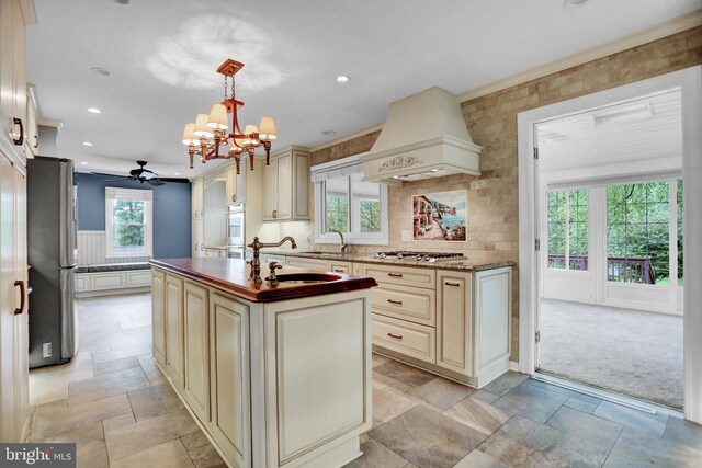 3228 Canterbury Ln, Fallston, MD 21047 - kitchen with cream cabinets, appliances with stainless steel finishes, custom range hood, recessed lighting, and ceiling fan