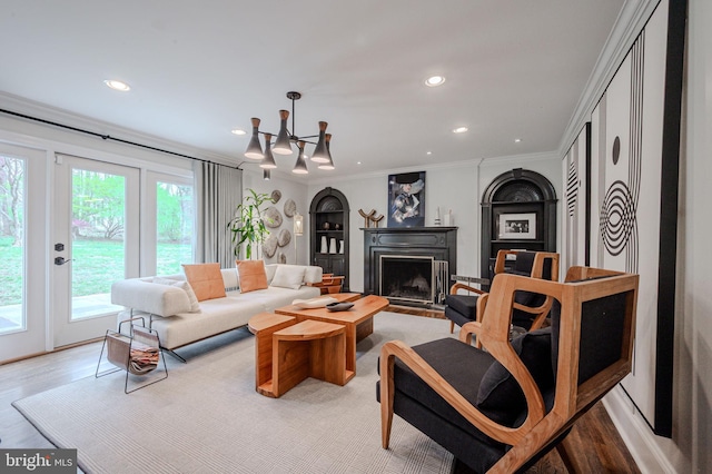 312 Center Hill Rd, Wilmington, DE 19807 - living room with light wood-type flooring, recessed lighting, a notable chandelier, and a fireplace