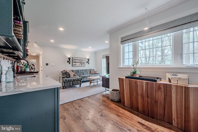 312 Center Hill Rd, Wilmington, DE 19807 - interior space featuring ornamental molding, light stone counters, open floor plan, light wood-style flooring, and a sink