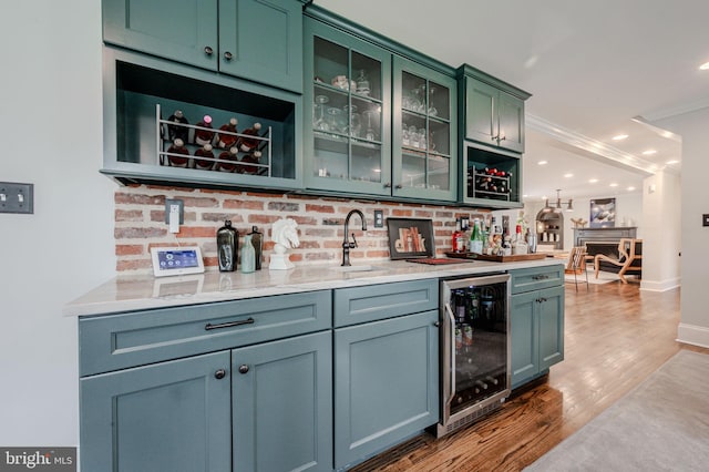 312 Center Hill Rd, Wilmington, DE 19807 - bar featuring tasteful backsplash, indoor wet bar, a sink, wine cooler, and wood finished floors