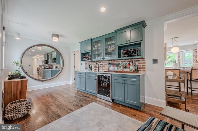312 Center Hill Rd, Wilmington, DE 19807 - bar with baseboards, wet bar, wine cooler, wood finished floors, and decorative backsplash
