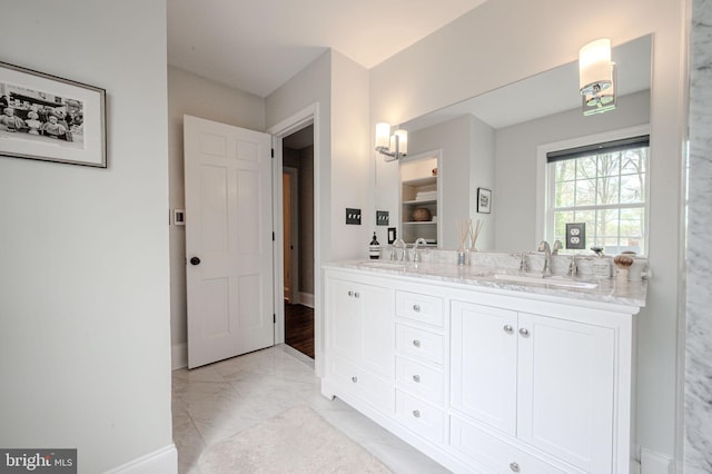 312 Center Hill Rd, Wilmington, DE 19807 - full bathroom featuring a sink, baseboards, double vanity, and marble finish floor