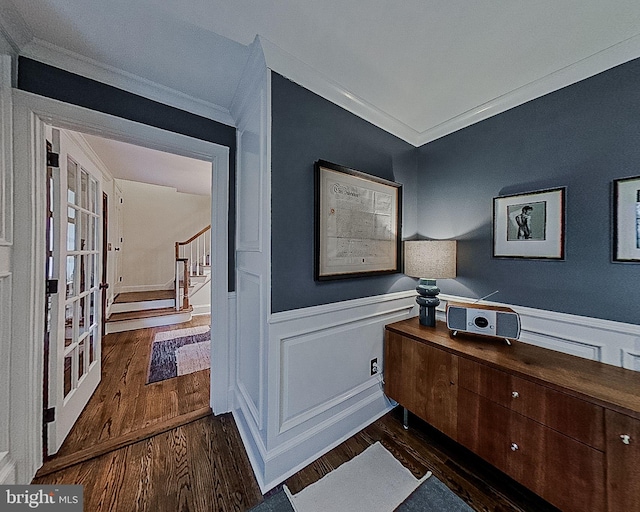 312 Center Hill Rd, Wilmington, DE 19807 - interior space featuring stairs, crown molding, a wainscoted wall, and wood finished floors