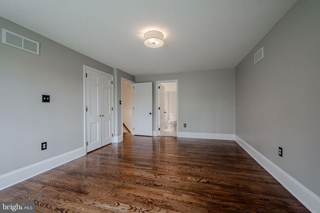 312 Center Hill Rd, Wilmington, DE 19807 - unfurnished bedroom with visible vents, baseboards, ensuite bathroom, and wood finished floors