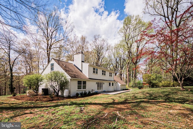 312 Center Hill Rd, Wilmington, DE 19807 - back of house with a wooden deck, a chimney, and a lawn