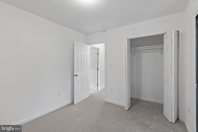 5338 Lightning View Rd, Columbia, MD 21045 - unfurnished bedroom with light colored carpet, a closet, and baseboards