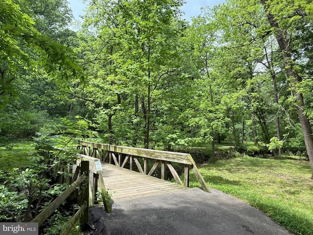 5338 Lightning View Rd, Columbia, MD 21045 - wooden deck featuring a wooded view and a yard