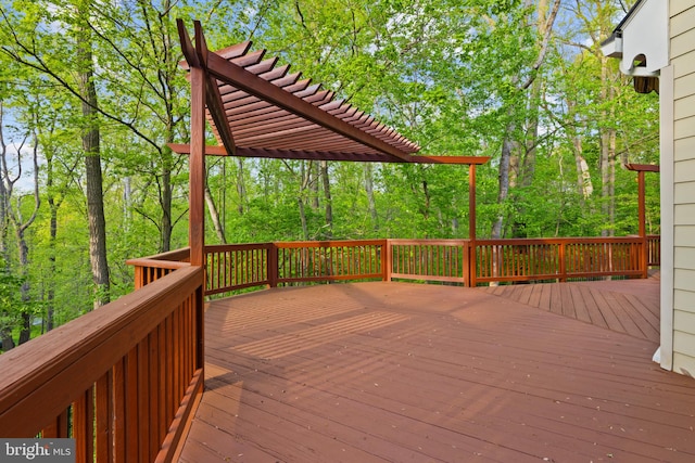 wooden deck featuring a pergola