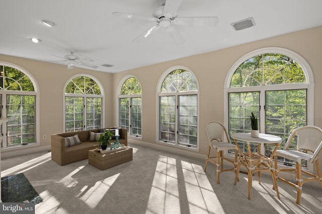 sunroom / solarium with carpet flooring, recessed lighting, baseboards, and visible vents