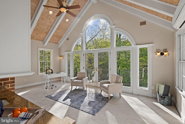 sunroom / solarium featuring beamed ceiling, french doors, and a wall mounted air conditioner