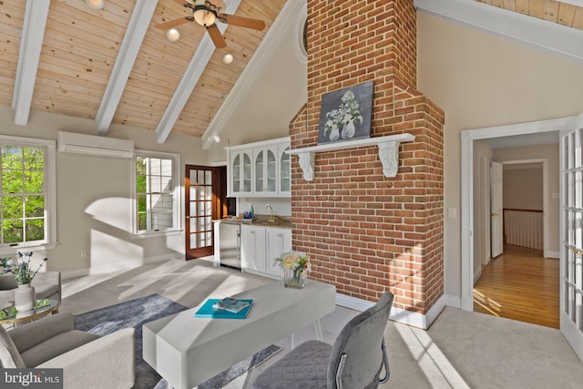 sunroom / solarium featuring an AC wall unit, a sink, and beam ceiling