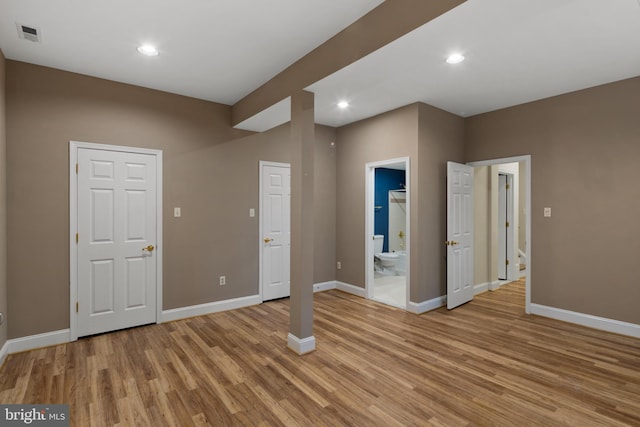 interior space featuring baseboards, recessed lighting, light wood-style flooring, and visible vents