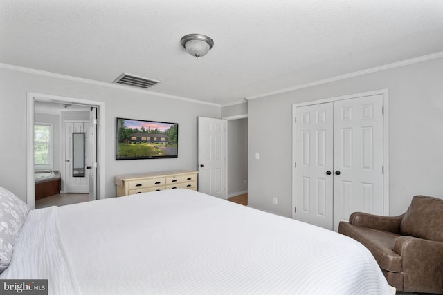 312 Richards Ferry Rd, Fredericksburg, VA 22406 - bedroom featuring crown molding, a closet, a textured ceiling, and ensuite bath