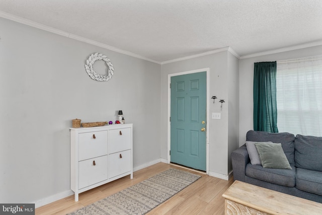 312 Richards Ferry Rd, Fredericksburg, VA 22406 - entryway featuring light wood-style floors, ornamental molding, baseboards, and a textured ceiling