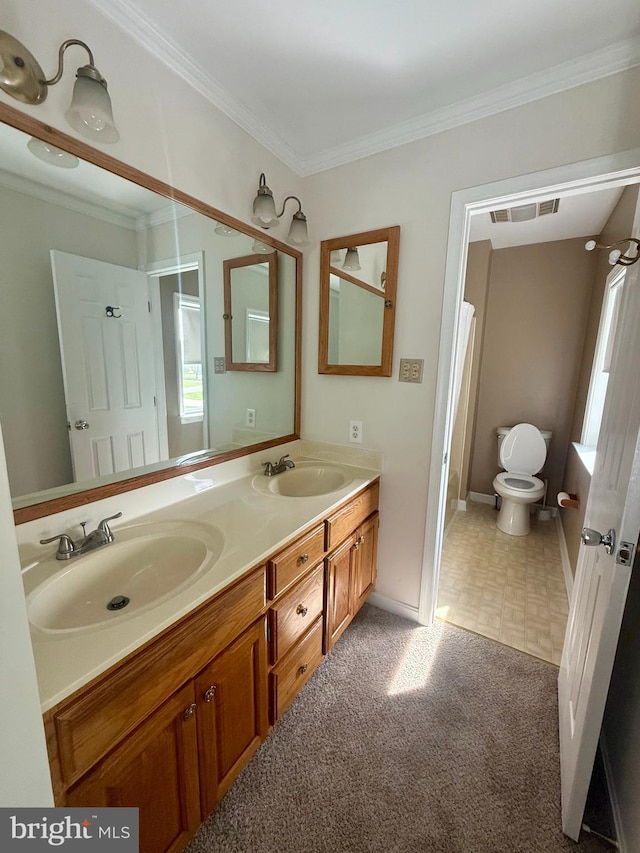 full bathroom featuring toilet, a sink, ornamental molding, and visible vents