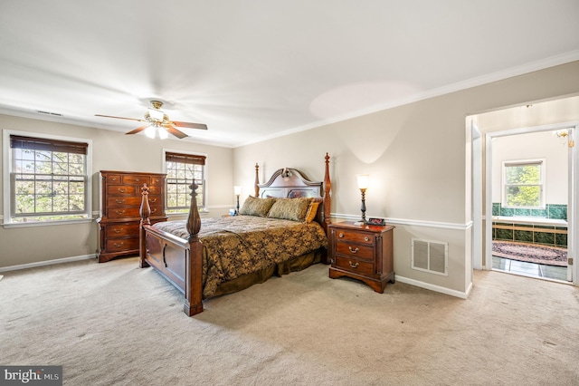 bedroom featuring visible vents, baseboards, ornamental molding, and carpet flooring