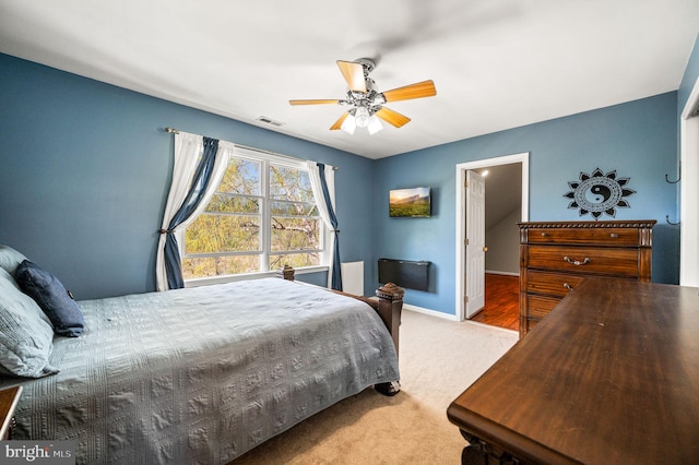 bedroom with carpet floors, visible vents, ceiling fan, and baseboards