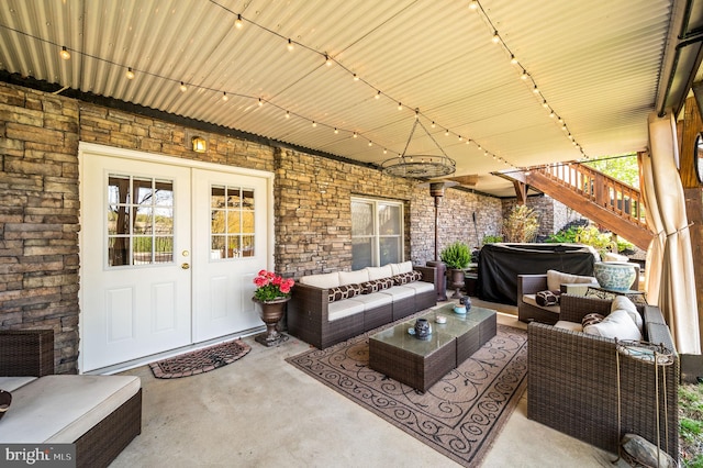 view of patio with an outdoor hangout area and stairs