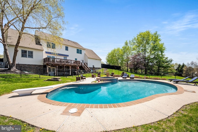 view of pool featuring a deck, a fenced backyard, stairway, a patio, and a lawn