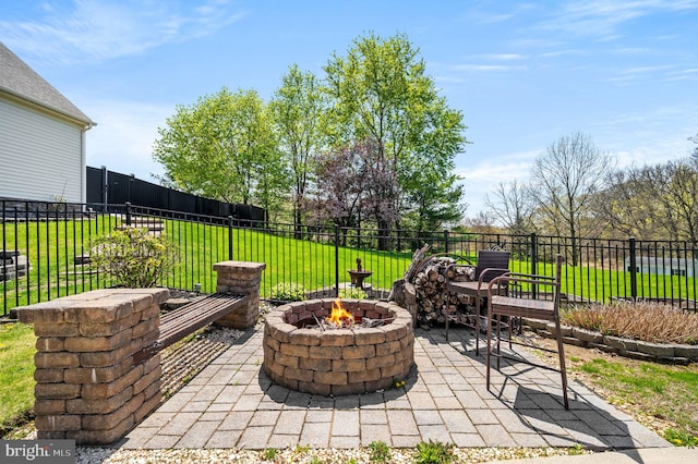 view of patio featuring a fire pit and fence
