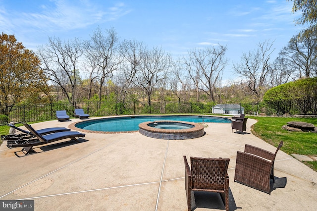 view of swimming pool featuring a patio, fence, and a pool with connected hot tub