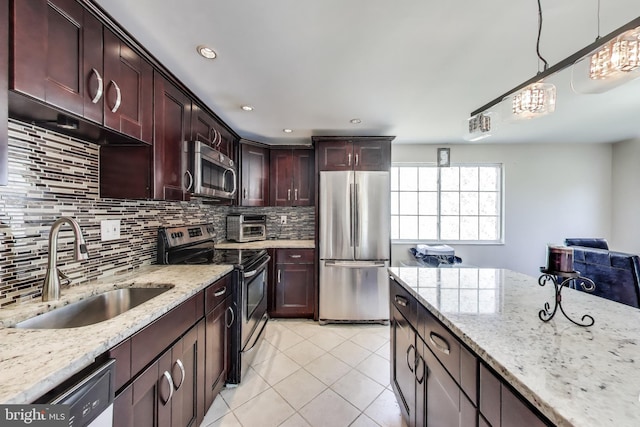 7910 E Nalley Rd, Hyattsville, MD 20785 - kitchen with stainless steel appliances, a sink, light tile patterned floors, backsplash, and light stone counters