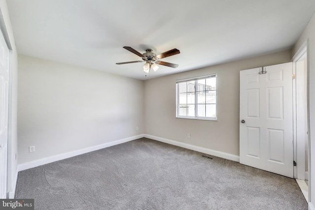 7910 E Nalley Rd, Hyattsville, MD 20785 - unfurnished bedroom featuring carpet flooring, baseboards, and a ceiling fan
