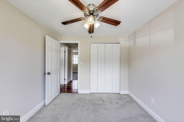 7910 E Nalley Rd, Hyattsville, MD 20785 - unfurnished bedroom featuring light colored carpet, baseboards, a closet, and a ceiling fan