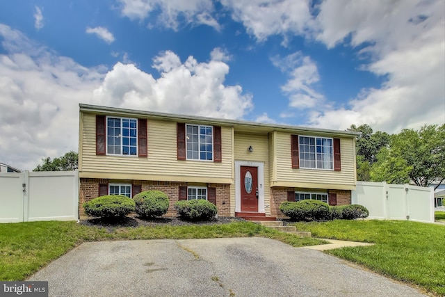 7910 E Nalley Rd, Hyattsville, MD 20785 - bi-level home featuring brick siding and a gate
