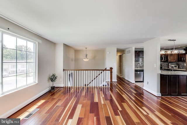 7910 E Nalley Rd, Hyattsville, MD 20785 - unfurnished room featuring wood finished floors and baseboards