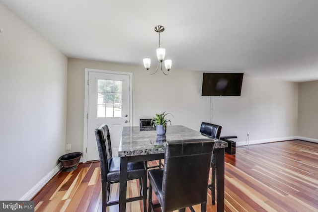 7910 E Nalley Rd, Hyattsville, MD 20785 - dining room with wood finished floors, a chandelier, and baseboards