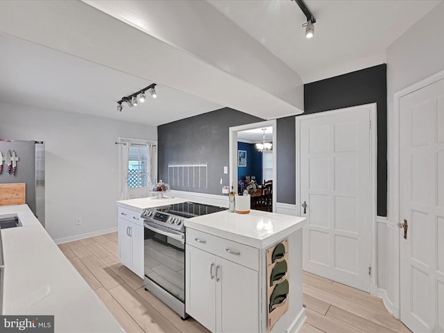341 Creston Rd, York, PA 17403 - kitchen featuring white cabinets, light countertops, wood tiled floor, and stainless steel appliances