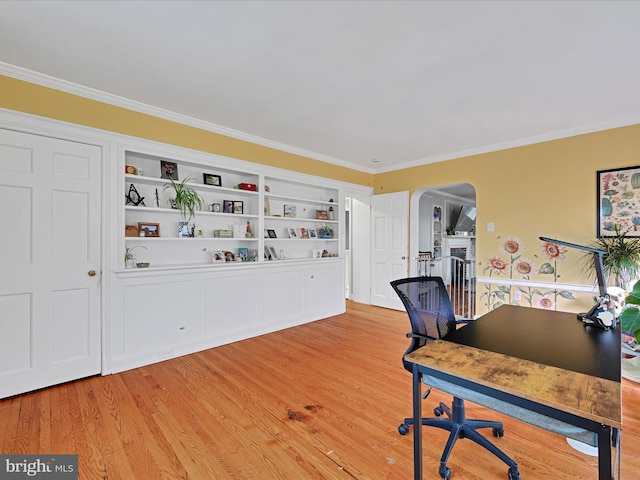 341 Creston Rd, York, PA 17403 - office area featuring light wood-style flooring, arched walkways, crown molding, and built in shelves